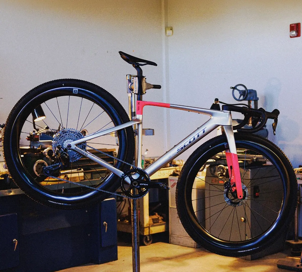 Robin Gemperle's Scott 32-inch gravel prototype on a work stand ahead of Unbound 2026