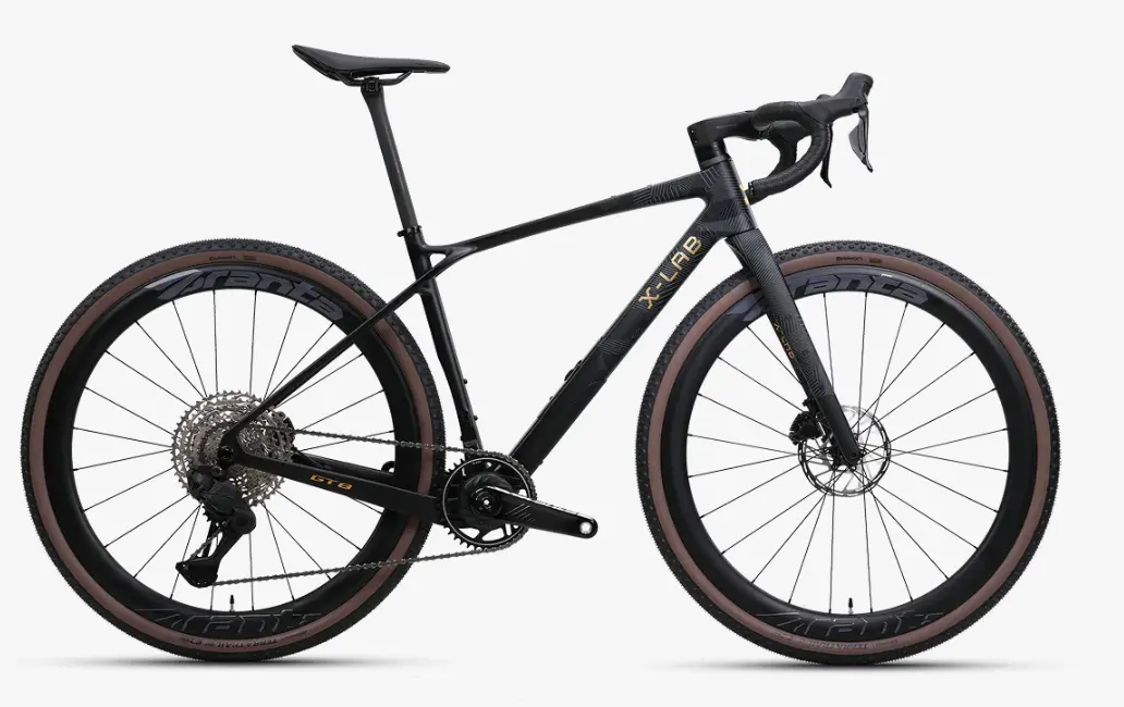 XDS X-Lab GT8 carbon gravel bike in black with gold accents and tan wall tires